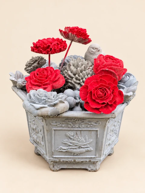 Red and light flower arrangement with bird figures in a greyish hexagonal container, main view