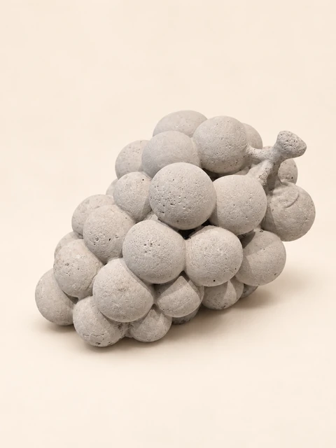 Cast grape cluster with rounded grapes and a short stem, in light concrete colour